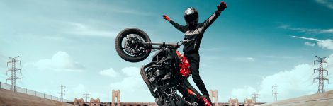 moto-rider-making-stunt-his-motorbike-biker-doing-difficult-dangerous-stunt moto-rider-making-stunt-his-motorbike-biker-doing-difficult-dangerous-stunt